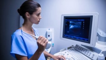 Sonographer using an ultrasound machine